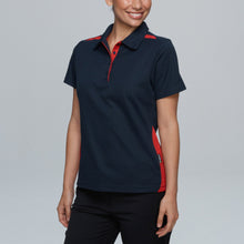 Load image into Gallery viewer, Woman wearing a navy and red polo shirt against a gray background
