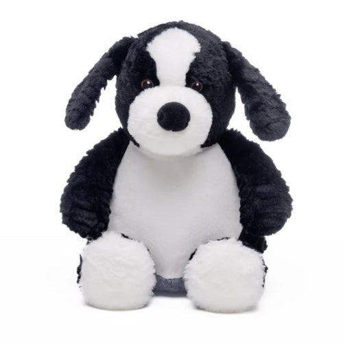 Black and white stuffed dog toy on a white background