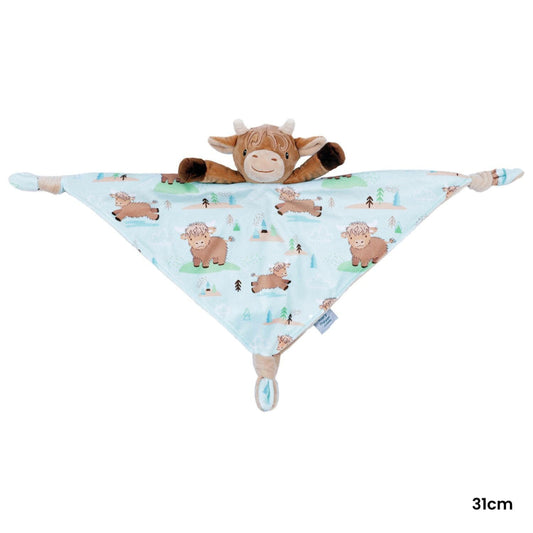 Baby comfort blanket with cow pattern and plush toy on a white background