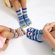 Load image into Gallery viewer, Children wearing colorful patterned socks on a white background
